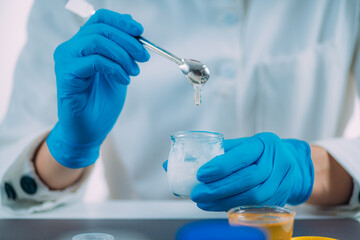 Pharmacist Using Honey for Beauty Cream