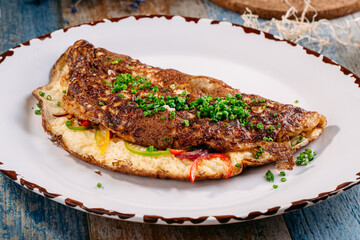 Fried omelet with vegetables and green onions