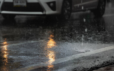 Wet road in the city with light reflections,twilight scene after hard rain fall.
