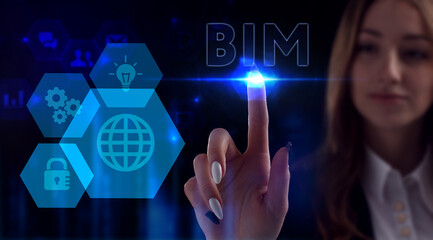 Business, Technology, Internet and network concept. Young businessman working on a virtual screen of the future and sees the inscription: BIM