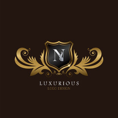 Golden N Logo Luxurious Shield, creative vector design concept for luxury brand identity.