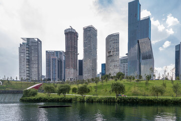Fototapeta premium View of La Mexicana urban park in Santa Fe, Mexico CIty with skyline of residential and office buildings