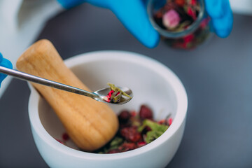 Grinding Herbs and Flowers Using Mortar and Pestle