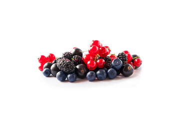 Fruits, berries isolated on white background. Fruits and berries with copy space for text. Red currant, blackcurrant, blueberry, mulberry. Mixed berries isolated on white background. Berries close-up.