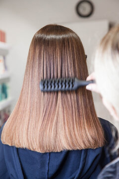 Beautiful Slavic hair on the model after care and restoration procedures in a beauty salon