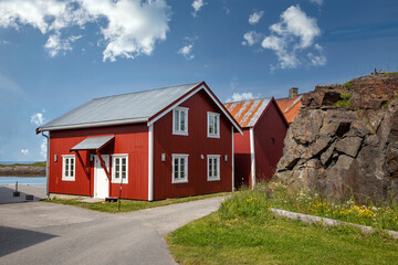 Fototapeta na wymiar Red seahouses on Nes, the island of Vega in Nordland county
