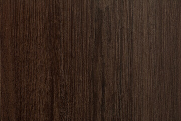 Texture of dark wood covered with varnish