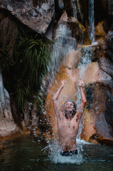 Fototapeta na wymiar Boy in a natural pool.