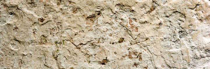 Texture of a concrete wall with cracks and scratches which can be used as a background