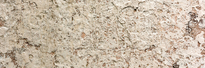 Texture of a concrete wall with cracks and scratches which can be used as a background