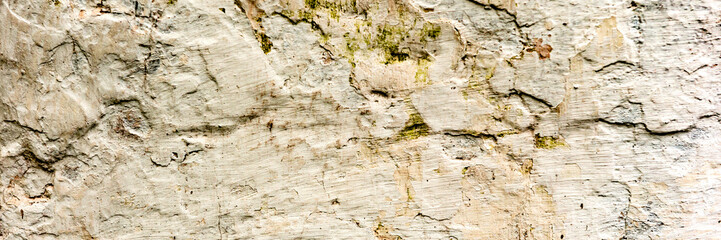 Texture of a concrete wall with cracks and scratches which can be used as a background