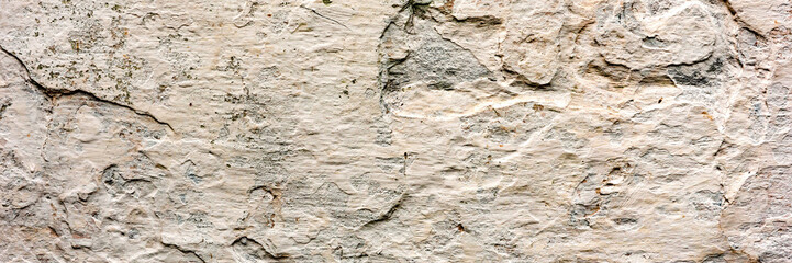 Texture of a concrete wall with cracks and scratches which can be used as a background