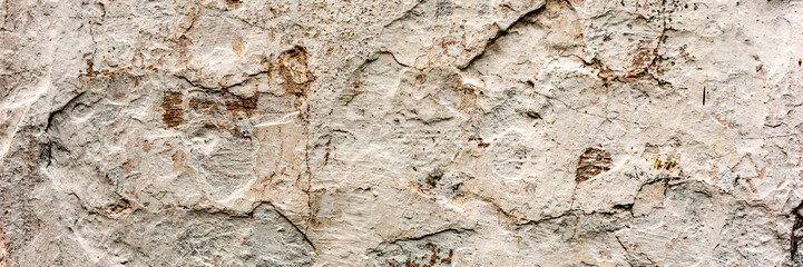 Texture of a concrete wall with cracks and scratches which can be used as a background