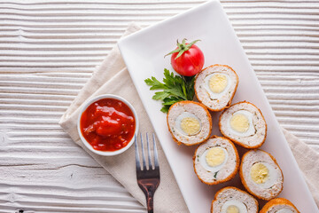 Scotch egg meat balls on rustic wooden background