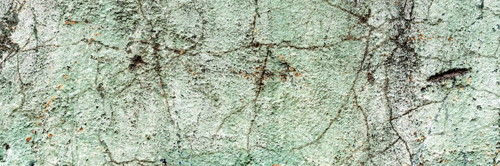 Texture of a concrete wall with cracks and scratches which can be used as a background