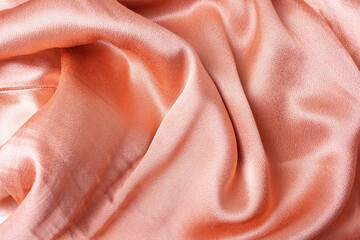 Satin pink peach fabric background. Flat Lay Style