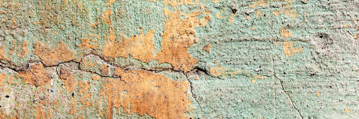 Fototapeta premium Texture of a concrete wall with cracks and scratches which can be used as a background