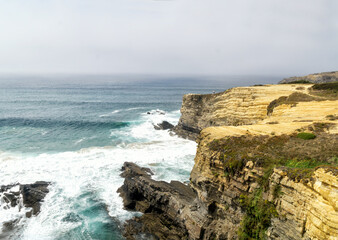 Fototapeta na wymiar Rota Vincentina. Cliffs on Vicentine Coast near Zambujeira do Mar beach and Alentejo Natural Park in Portugal.