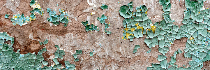 Texture of a concrete wall with cracks and scratches which can be used as a background