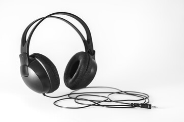 Black headphones on a white background