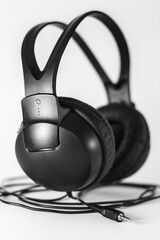 Black headphones on a white background