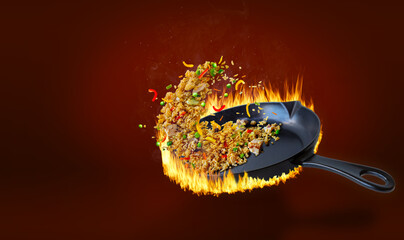 Delicious Chinese Fried Rice Tossing in Pan With Flaming Heat