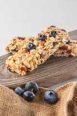 Granola bar with almonds and blueberries.
Healthy snack full of dietary fiber and nutrients.
