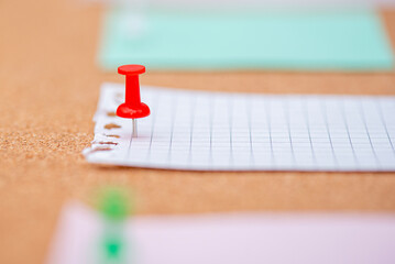 Close-up red pin in cork board