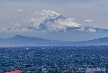 Fototapeta na wymiar Aerial view of Popocatepetl volcano in Mexico City