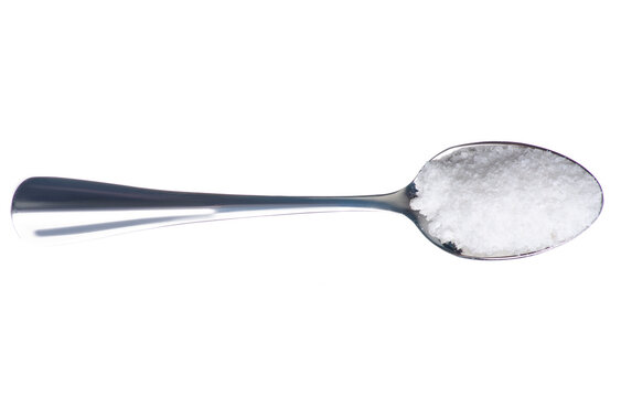Teaspoon with salt on white background isolation, top view
