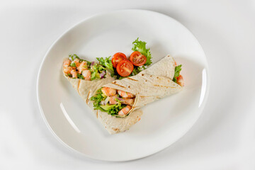 Shrimp tacos from Baja California, Mexico
Spicy wraps with seafood in flour tortilla and avocado