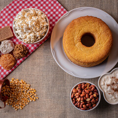 June party. Typical sweets from festa junina. Cornmeal cake, popcorn, hominy, paçoca, cocada, pumpkin jam, and peanuts