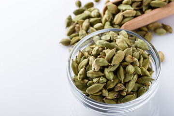 fragrant green cardamom on a white acrylic background