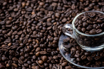 coffee beans in a cup and around the cup