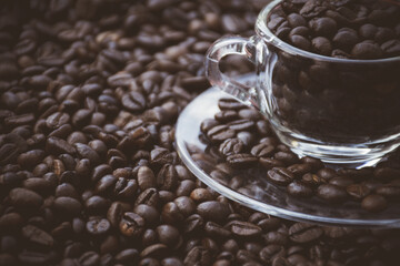 coffee beans in a cup and around the cup