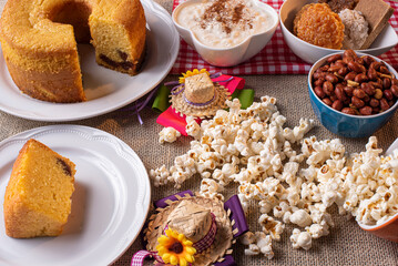 June party. Typical sweets from festa junina. Cornmeal cake, popcorn, hominy, paçoca, cocada, pumpkin jam, and peanuts