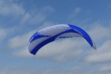Paragliding at the beach of Katwijk aan Zee. Paraglider's making use of updraft of the dunes to stay in the air