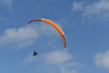Paragliding at the beach of Katwijk aan Zee. Paraglider's making use of updraft of the dunes to stay in the air