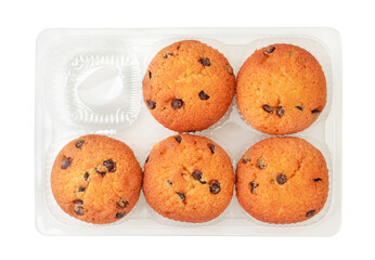 Muffin with pieces of chocolate in the package on a white background. Isolated