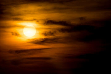 Sunset behind the clouds after rain
