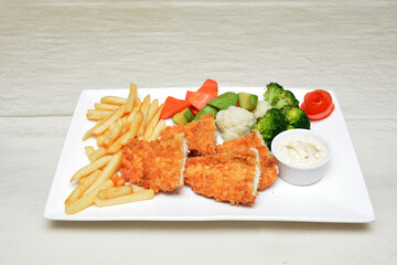 chicken fry with french fries and vegetable salad