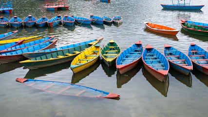 Fototapeta na wymiar Colored wooden boats Phewa lake Podhara Nepal