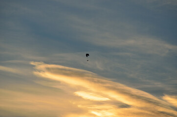 Paraglider on bright and vivid dawn sky in the arctic circle