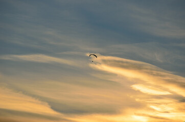Paraglider on bright and vivid dawn sky in the arctic circle