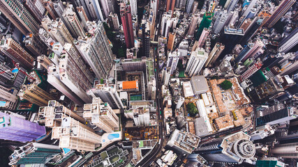 Top view aerial photo from flying drone of a Hong Kong Global City with advanced buildings, transportation, energy power infrastructure. Financial and business centers in developed China town