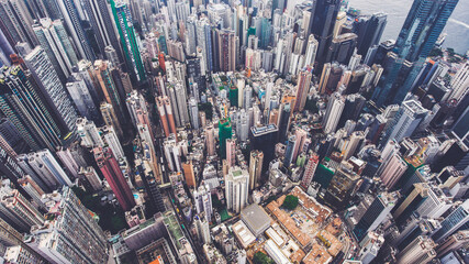 Fototapeta na wymiar Aerial photo from flying drone of an amazing landscape on a China city with modern skyscrapers and enterprises. Top view on a developed Hong Kong town with office buildings and advanced infrastructure