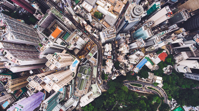 Top view aerial photo from flying drone of developed China city with tall skyscrapers and advanced transportation infrastructure.Office buildings in Hong Kong business district. Background for website