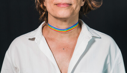 Decorative makeup with a gay pride theme.Gay pride choker. Lady's neck with gay pride makeup. Gay...