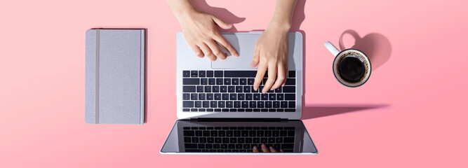 Person using a laptop computer from above