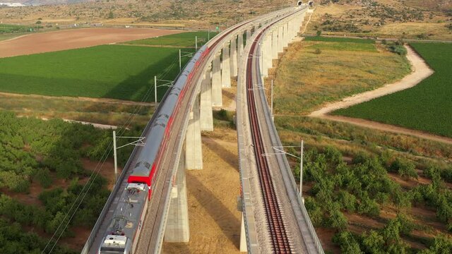 Modern Passengers train riding on Bridge &ndash; Aerial top down view
Modiin/ Israel/ June,22, 2020
